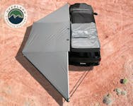 Overland Vehicle Systems 19609908 Nomadic 180 - Dark Gray Awning with Bracket Kit and Extended Poles