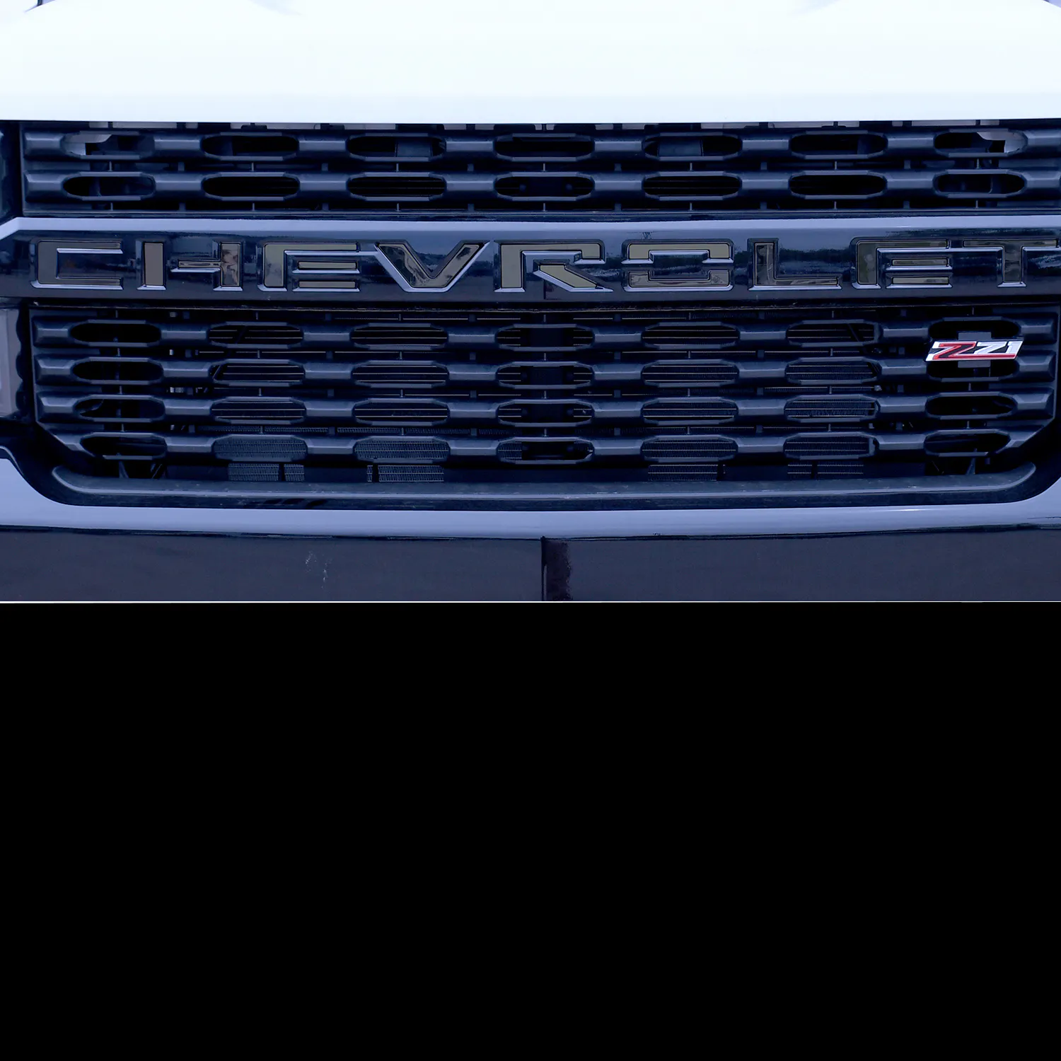 https://aw1.imgix.net/3/putco/Putco-Chevrolet-Grille-Stamped-Lettering-Black-Finish.jpg