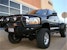Road Armor 44062B (4x) 4-inch diameter : PIAA 510 or Quake LED QFR199 and (3x) Light Tabs on Titan