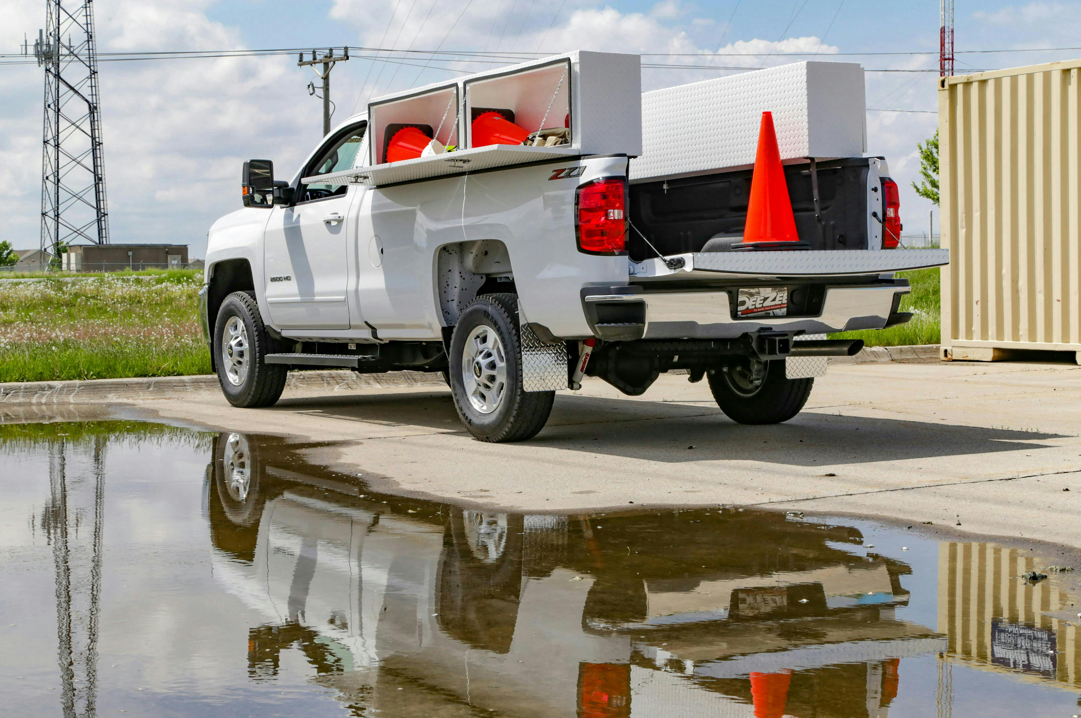 Upfitted commercial truck with ladder rack and toolboxes