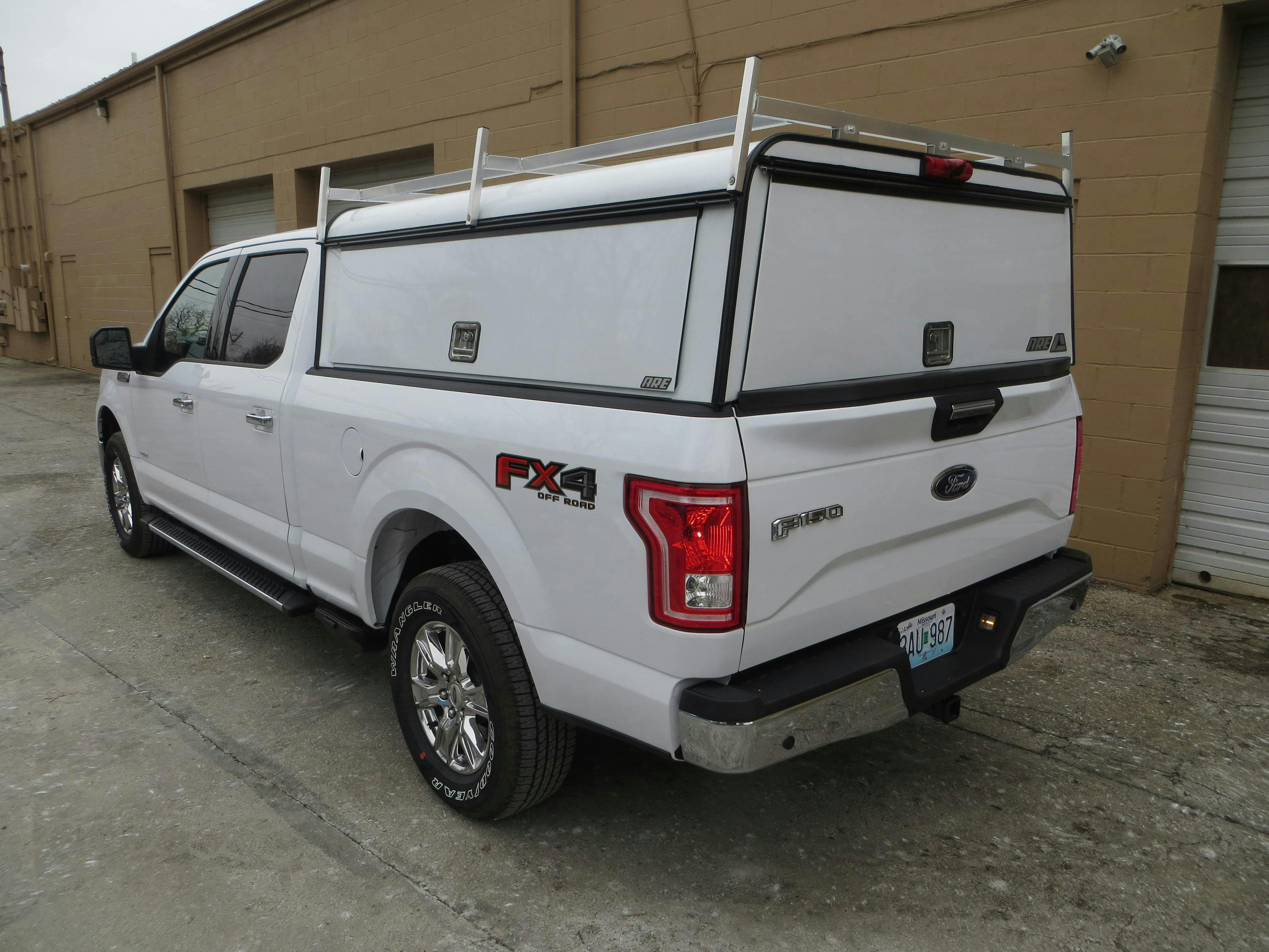 Service van interior showing shelving, bins, and organized tool storage