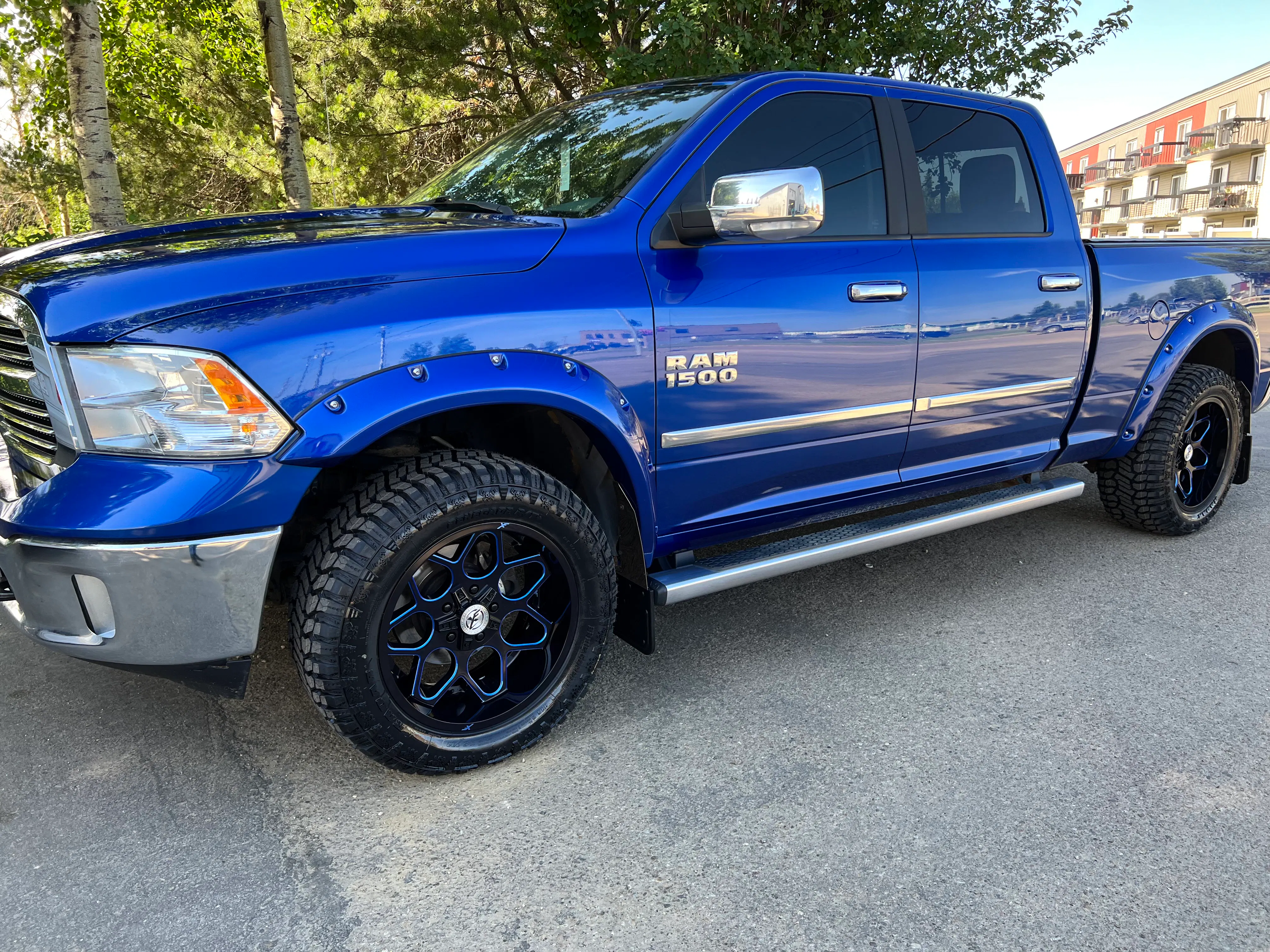 2017 Ram 1500 with XF Offroad wheels, Radar R/T tires, and Bushwacker fender flares
