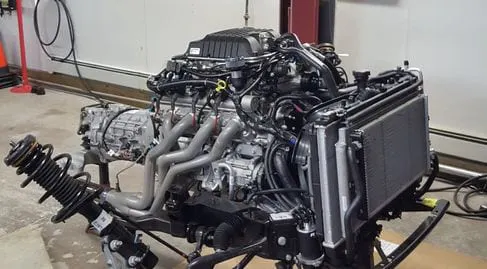 Technician working on engine bay