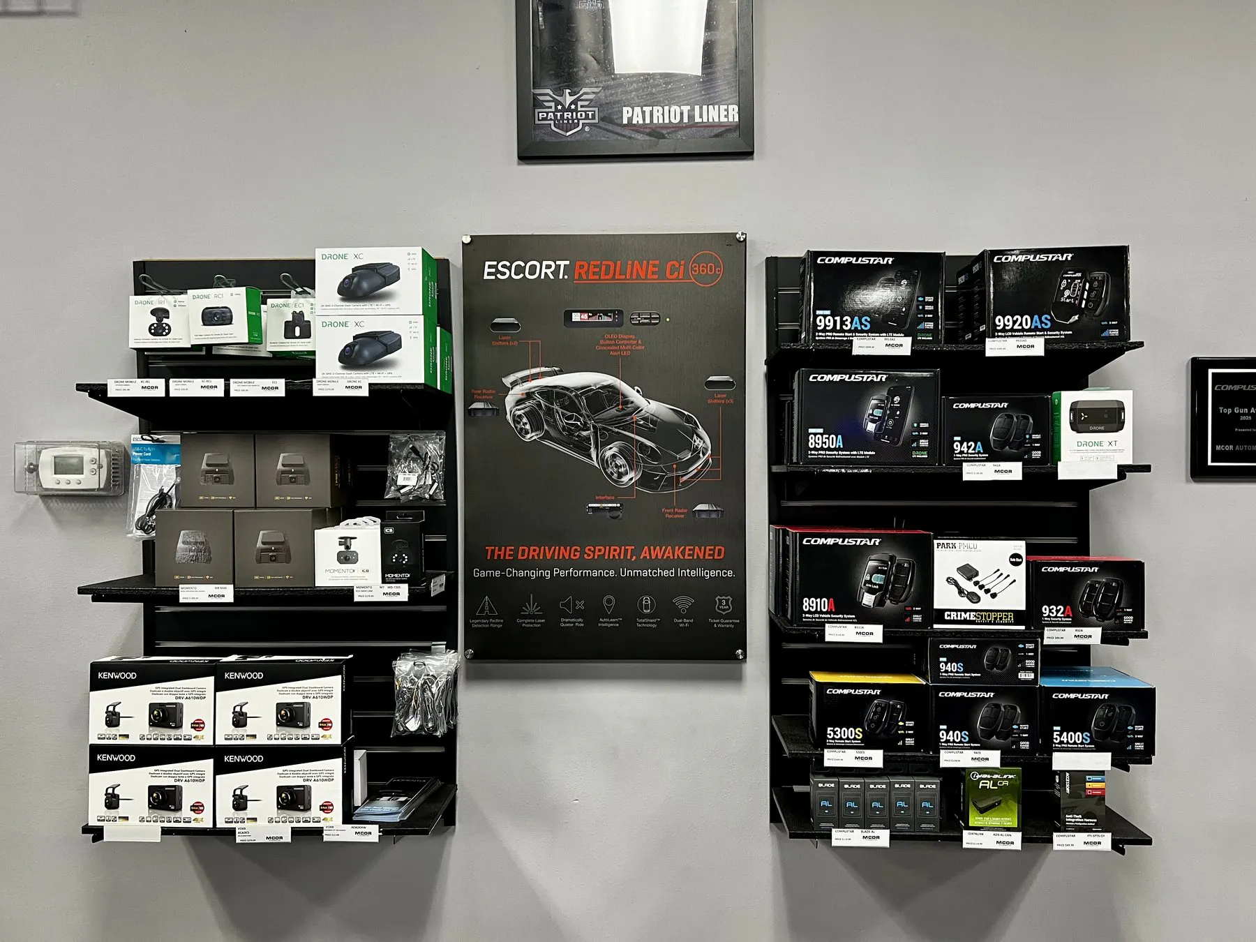 Backup camera, radar and driver-safety displays inside the MCOR Automotive showroom