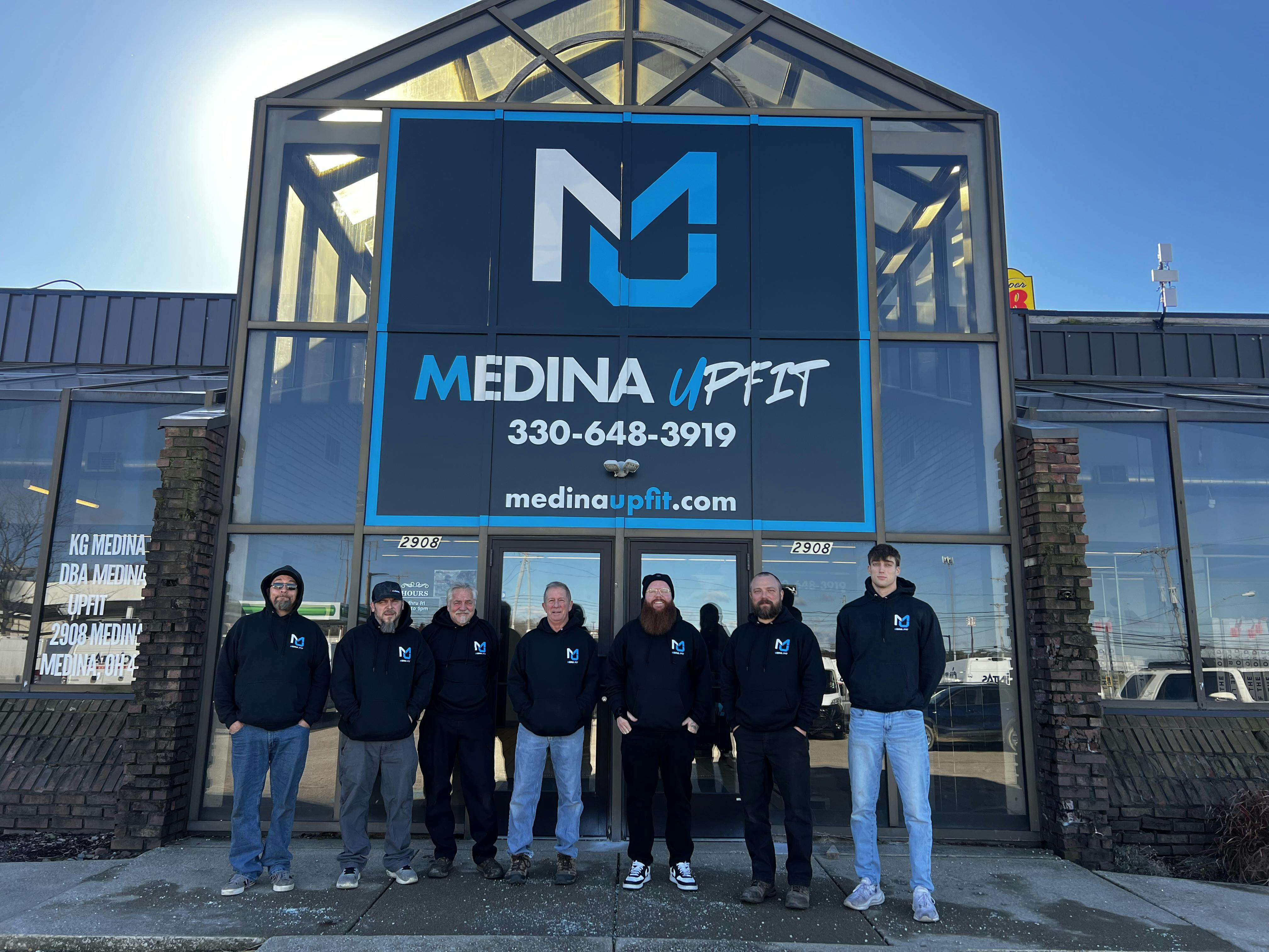 Medina UpFit team standing in front of the shop