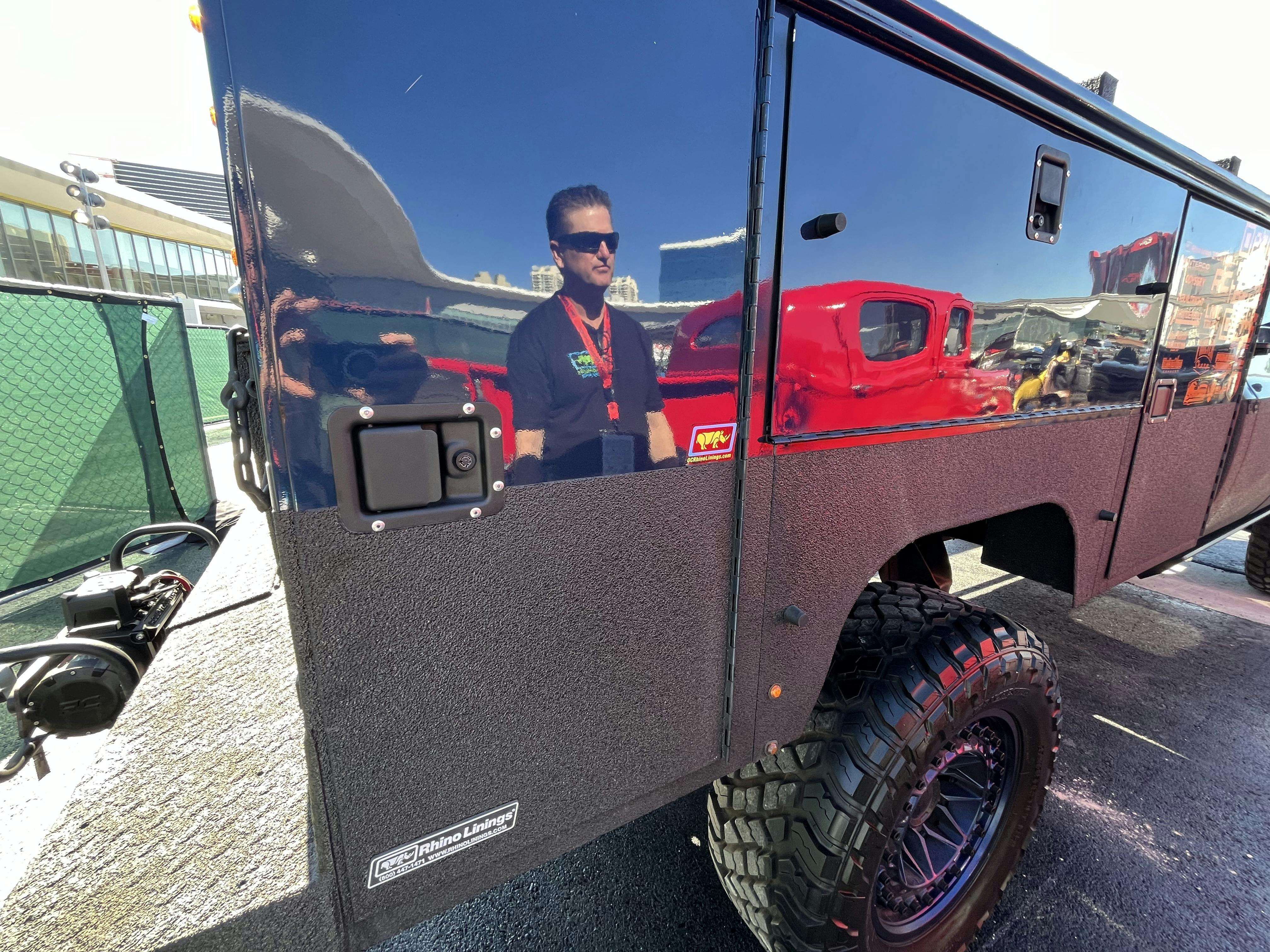 A person standing in a vehicleAI-generated content may be incorrect.