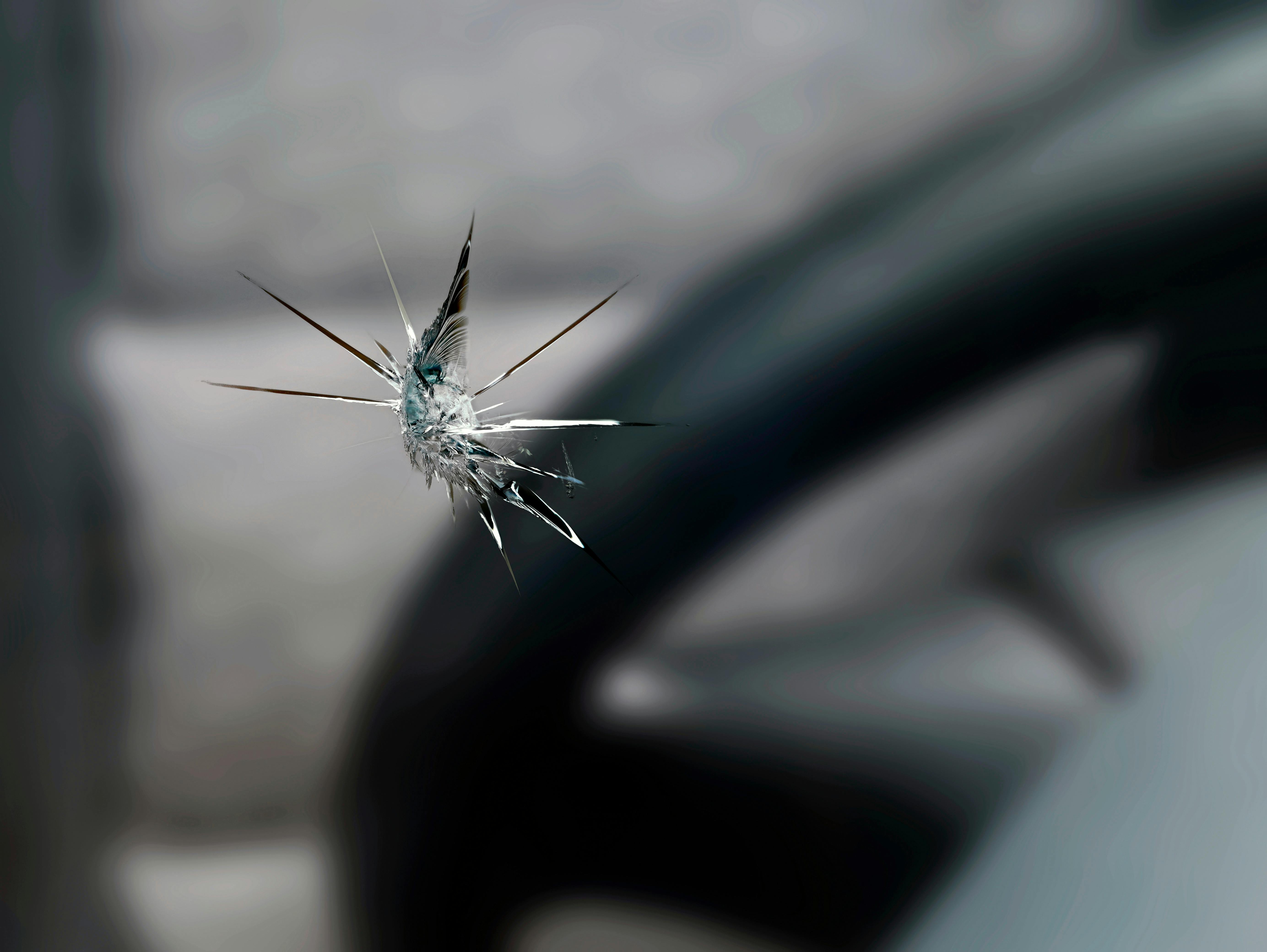 Technician performing rock chip repair on a windshield