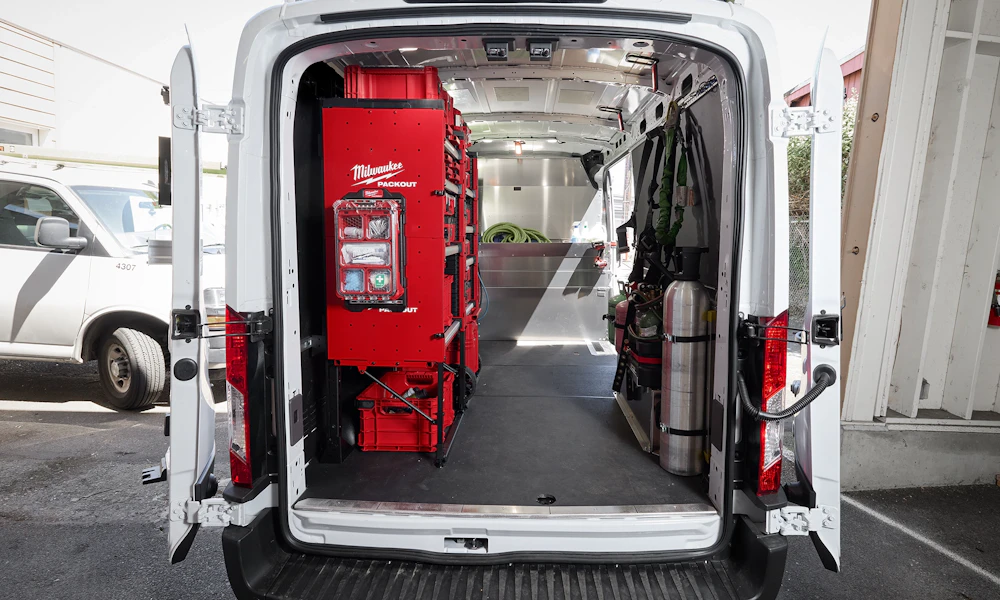 Milwaukee PACKOUT storage system organized inside a commercial work van